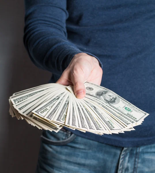 Business Man Displaying a Spread of dollars — Stock Photo, Image