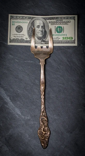 Hundred dollars on old fork — Stock Photo, Image