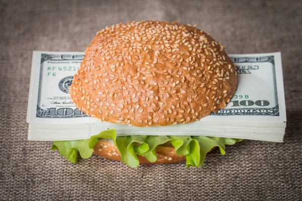 Hamburger with dollar bank notes — Stock Photo, Image