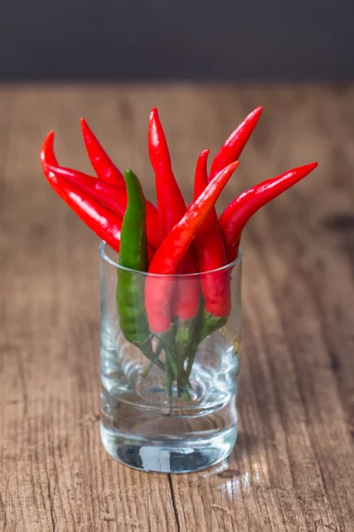 Red chile pepper  in glass — Stock Photo, Image