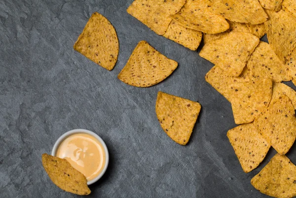 Nachos with cheese sauce — Stock Photo, Image