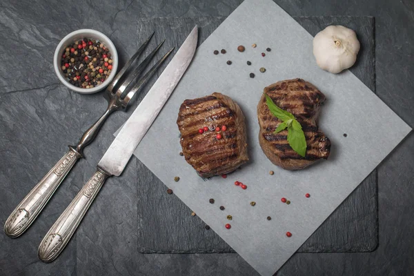 Grilled beef steak close up on paper — Stock Photo, Image