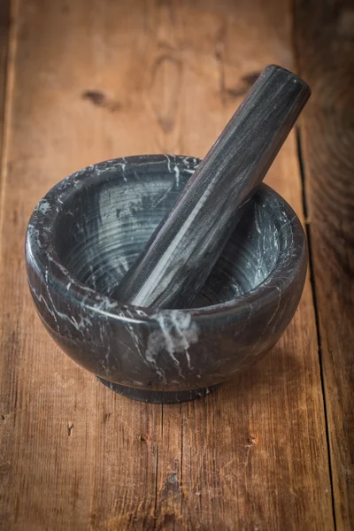 Black marble mortar with pestle — Stock Photo, Image