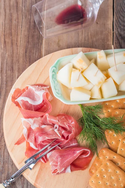 Italian food with melon and prosciutto — Stock Photo, Image