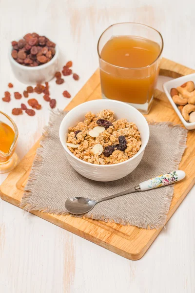 Granola, honey, nuts and raisins — Stock Photo, Image