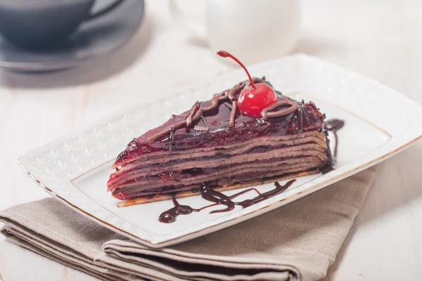 Layered chocolate cake  with  cherries — Stock Photo, Image