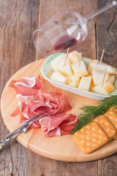 Italian food with melon and prosciutto — Stock Photo, Image