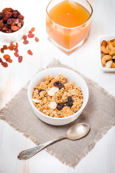 Granola, honey, nuts and raisins — Stock Photo, Image