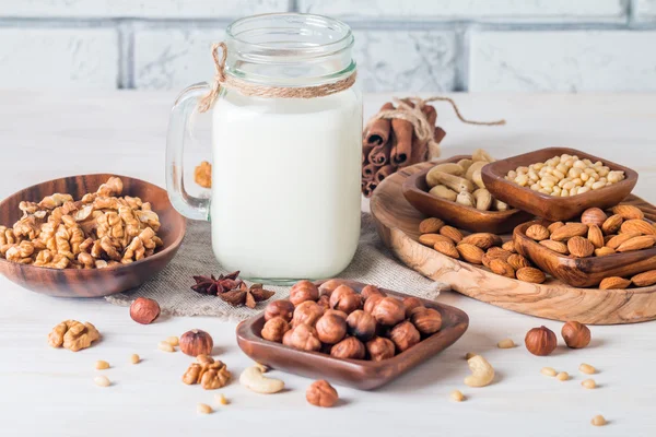 Vegan milk from nuts in glass jar — Stock Photo, Image