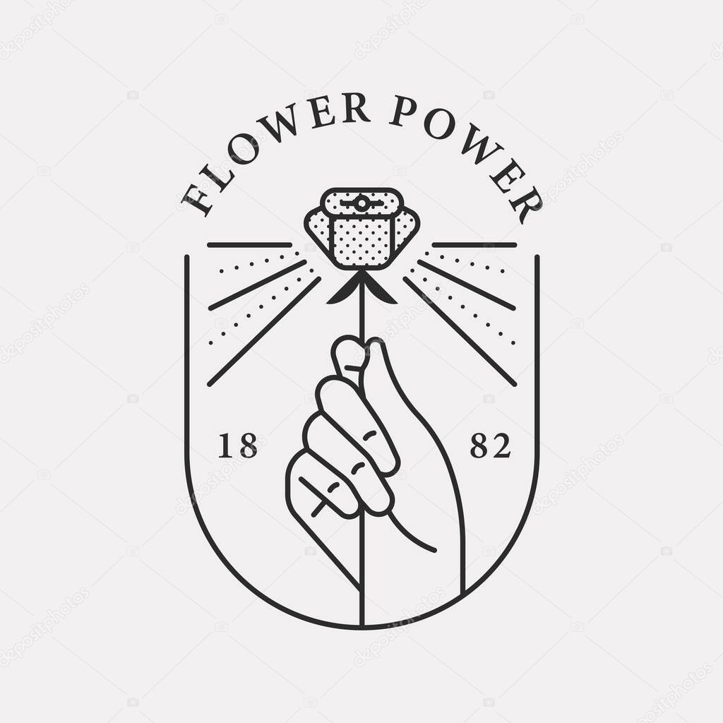 Illustration logo of a hand holding a beautiful rose. Black color hipster design.