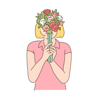 A woman is holding a flower in her hand and covering her face.