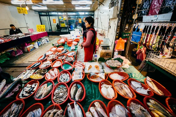 Fish vendor at a street market in the Zhongzheng District, Taipe