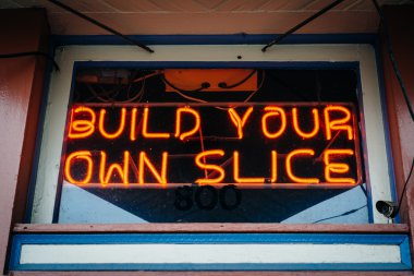 Build Your Own Slice sign in Fells Point, Baltimore, Maryland. clipart