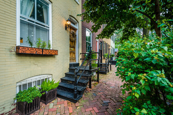 Houses and brick sidewalk in the Old Town of Alexandria, Virginia.