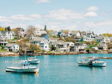 Boats in the harbor of the fishing village of Stonington, on Deer Isle in Maine clipart