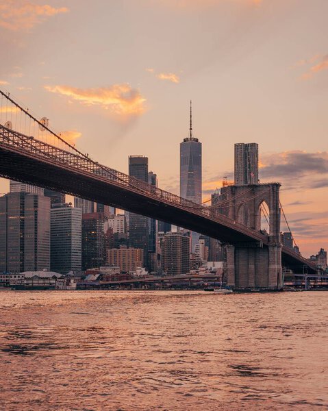 Sunset over the East River and Brooklyn Bridge with Manhattan skyline, from Dumbo, Brooklyn, New York City