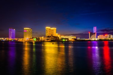 Casinos reflecting in Clam Creek at night in Atlantic City, New  clipart
