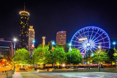 Ferris wheel and buildings seen from Olympic Centennial Park at  clipart