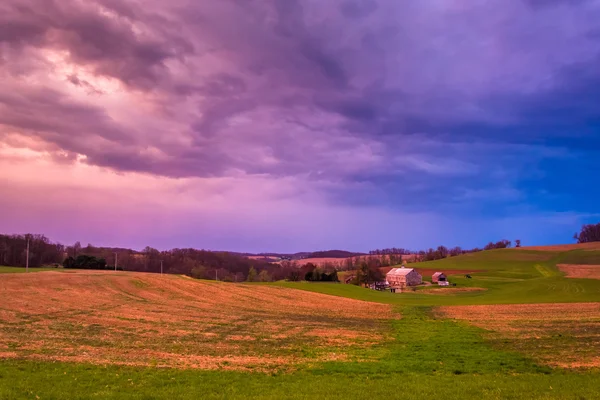 Dramatic sunset sky over a farm in rural York County, Pennsylvan
