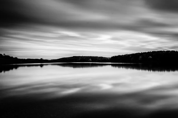 Evening long exposure of clouds moving over  Long Arm Reservoir, — Stock Photo, Image