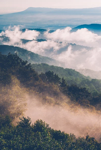 Fog and low clouds clear out of the Blue Ridge after a summer th