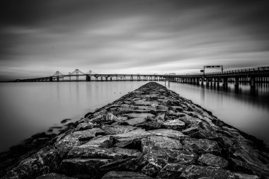 Long exposure of a jetty and the Chesapeake Bay Bridge, from San clipart