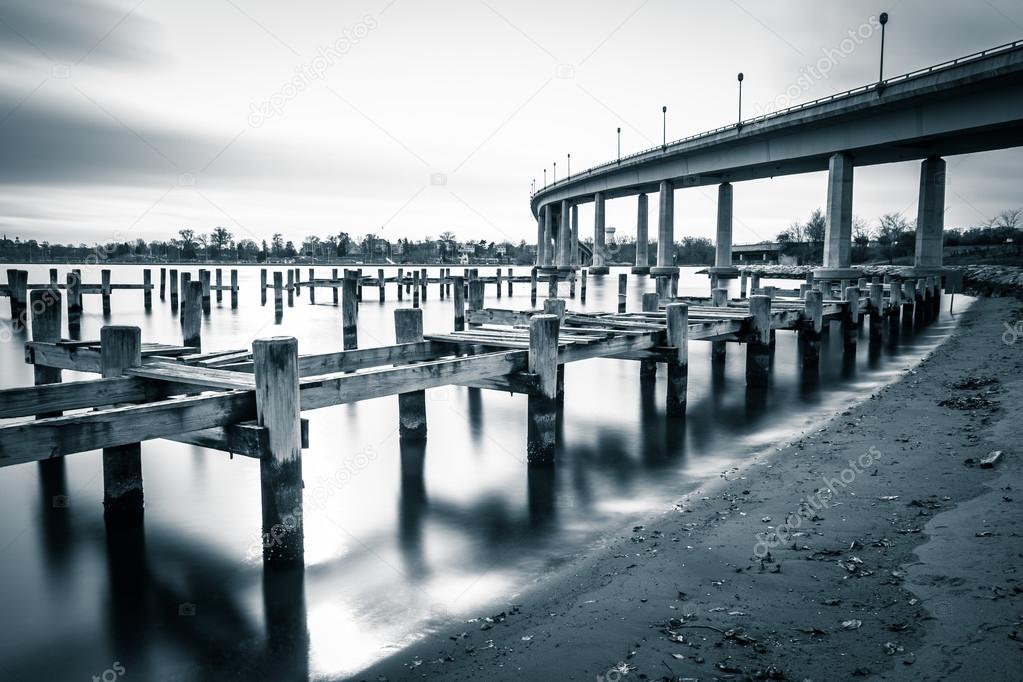 Pier posts in the Severn River and the Naval Academy Bridge, in 