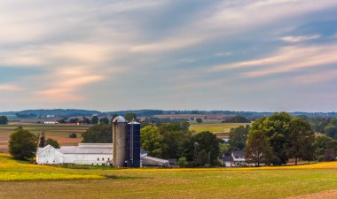View of a barn and silos on a farm in rural Lancaster County, Pe clipart