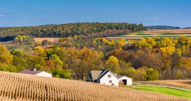 View of a house and rolling hills in rural York County, Pennsylv clipart