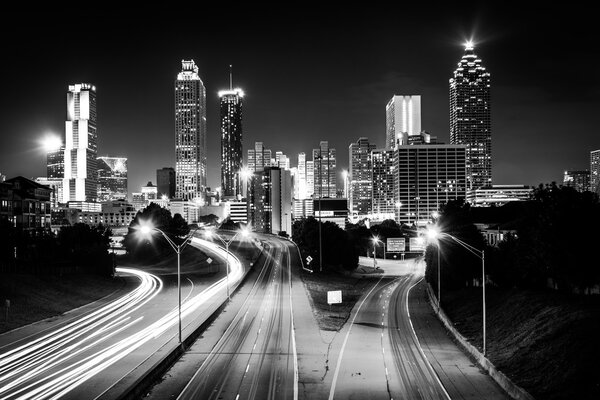 Traffic on Freedom Parkway and the Atlanta skyline at night, see