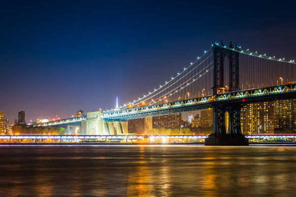 Manhattan Bridge at night, seen from Brooklyn Bridge Park, in Brooklyn, New York.