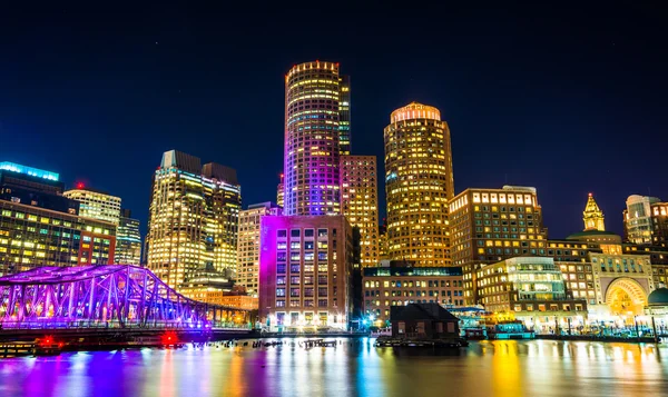 The Boston skyline and Fort Point Channel at night from Fan Pier