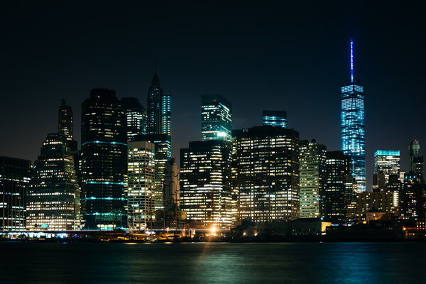 The Manhattan Skyline at night, seen from Brooklyn Bridge Park, Brooklyn, New York.