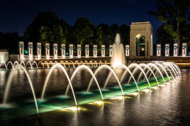 The National World War II Memorial Fountains at night at the Nat clipart