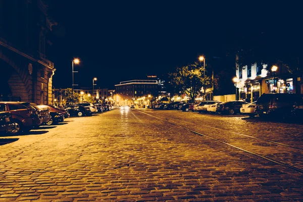 Cobblestone street in Fells Point at night, Baltimore, Maryland.