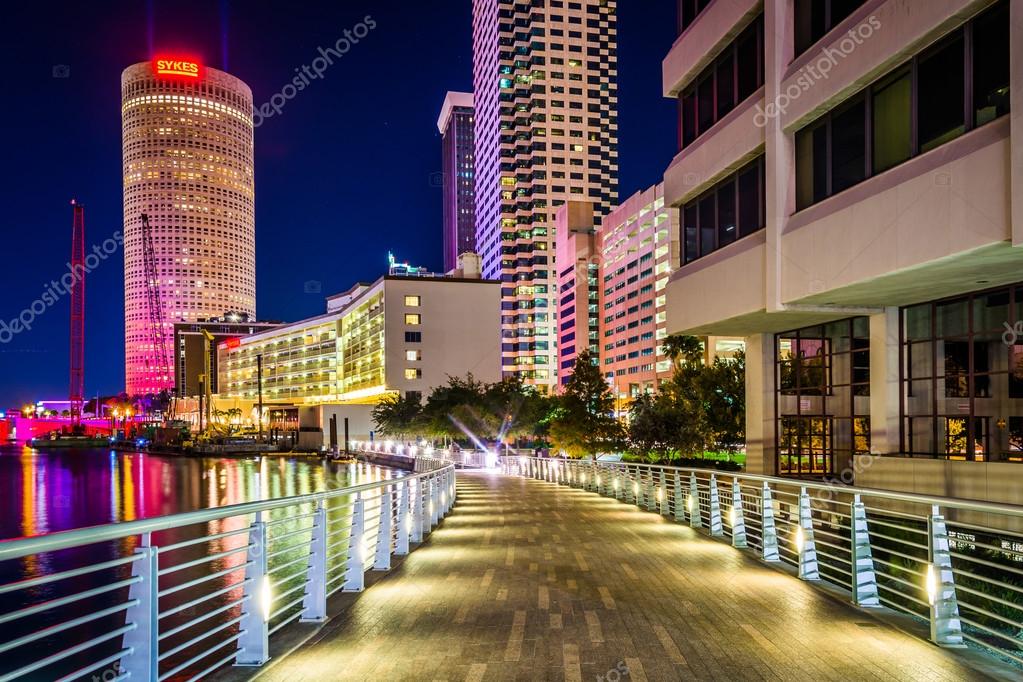 The Riverwalk and skyscrapers at night in Tampa, Florida. Stock