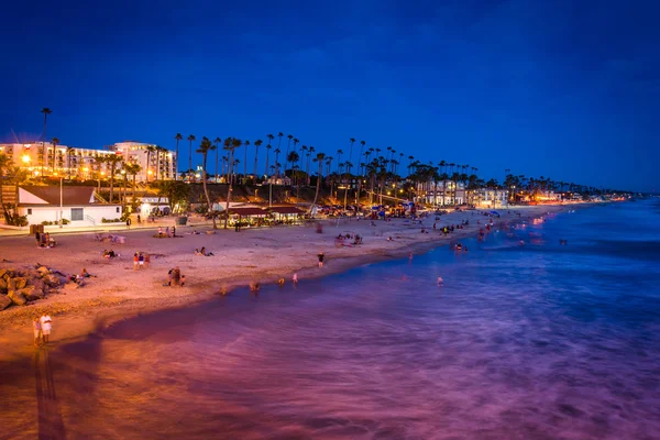 The beach at night, seen from the pier in Oceanside, California. — Stock Photo, Image