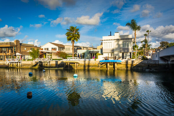 Boats and houses along Beacon Bay, in Newport Beach, California.