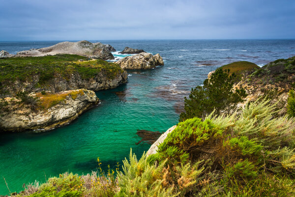 View of beautiful turquoise waters and rocky bluffs at Point Lob