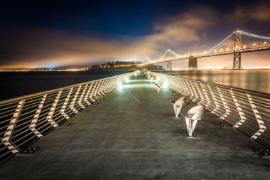 Pier 14 and the San Francisco - Oakland Bay Bridge at night, in  clipart