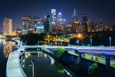 The skyline and Schuylkill Banks Boardwalk seen at night from th clipart