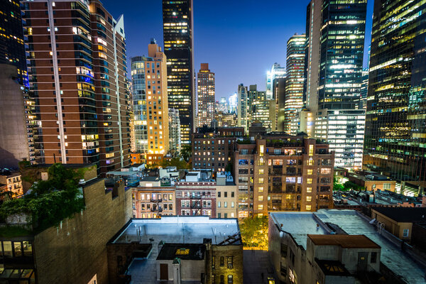 View of buildings in Midtown East at night, in Manhattan, New York.