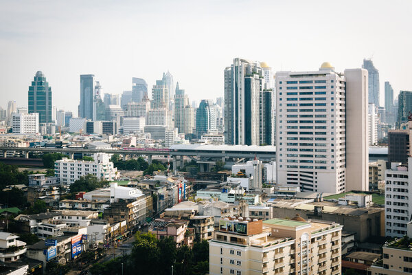 Hazy view of skyscrapers in Bangkok, Thailand.