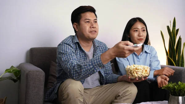 Happy Young Asian Couple Laying Sofa Cozy Living Room Watching — Stock Photo, Image