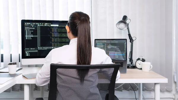 Asian Woman programmer typing source codes Programming On Computer in office, freelance web developer concept