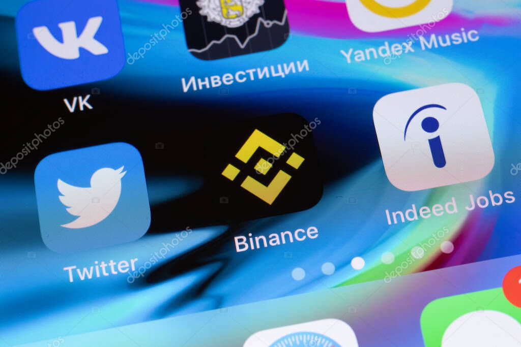New York, USA - 26 April 2021: Binance app logo on phone screen close-up top view, Illustrative Editorial