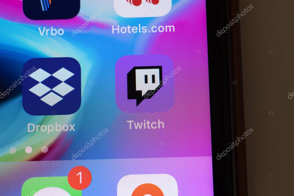 New York, USA - 26 April 2021: Twitch app logo on phone screen close-up top view, Illustrative Editorial.