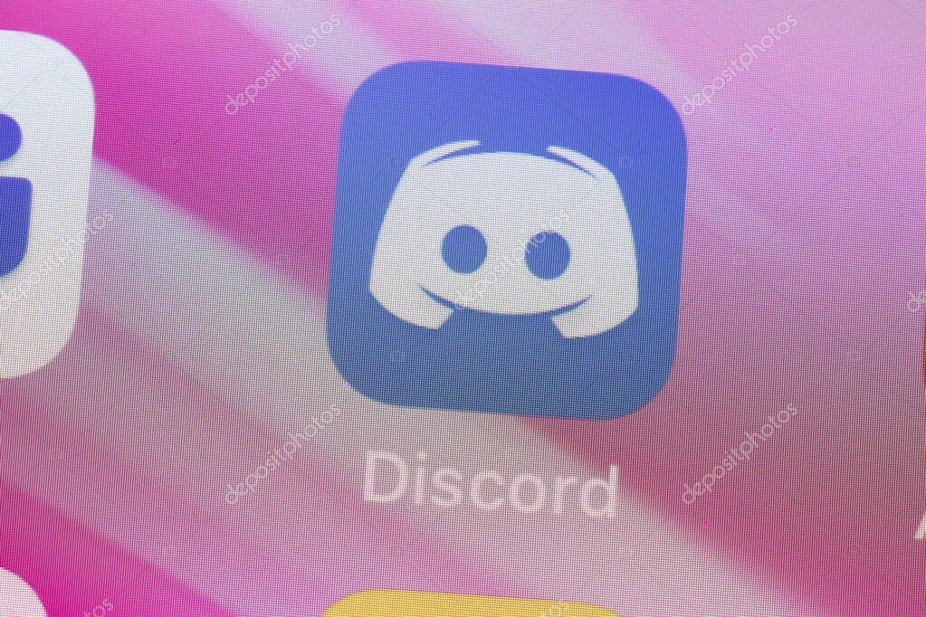 New York, USA - 26 April 2021: Discord app logo on phone screen close-up top view, Illustrative Editorial