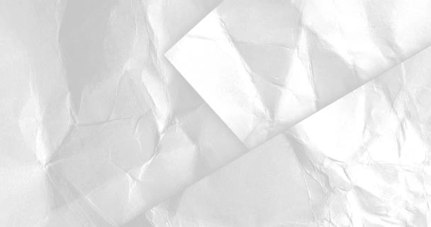 Бумажный фон. Перемещение скомканной белой бумаги — стоковое видео