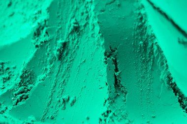 Kuru holi tozu veya gulal yakın çekim. Nane, cyan, turkuaz renkli abir, holi tozu. Geleneksel Hint renk festivali konsepti.